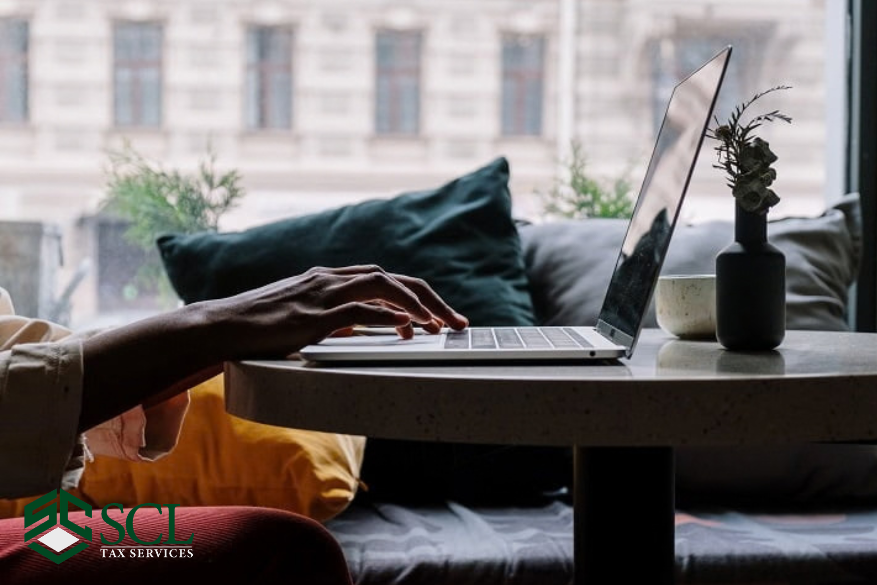 a woman trying use client login portal at SCL Tax Services in Bronx, NY .10470