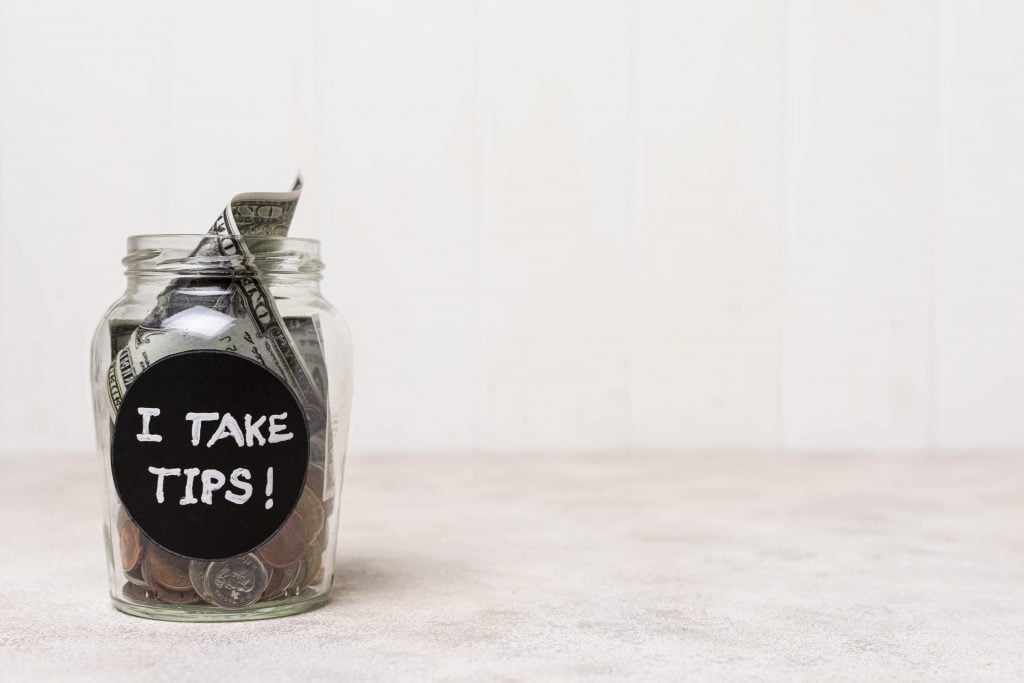 a jar full of tips for report tip tax in & near Bronx, NY