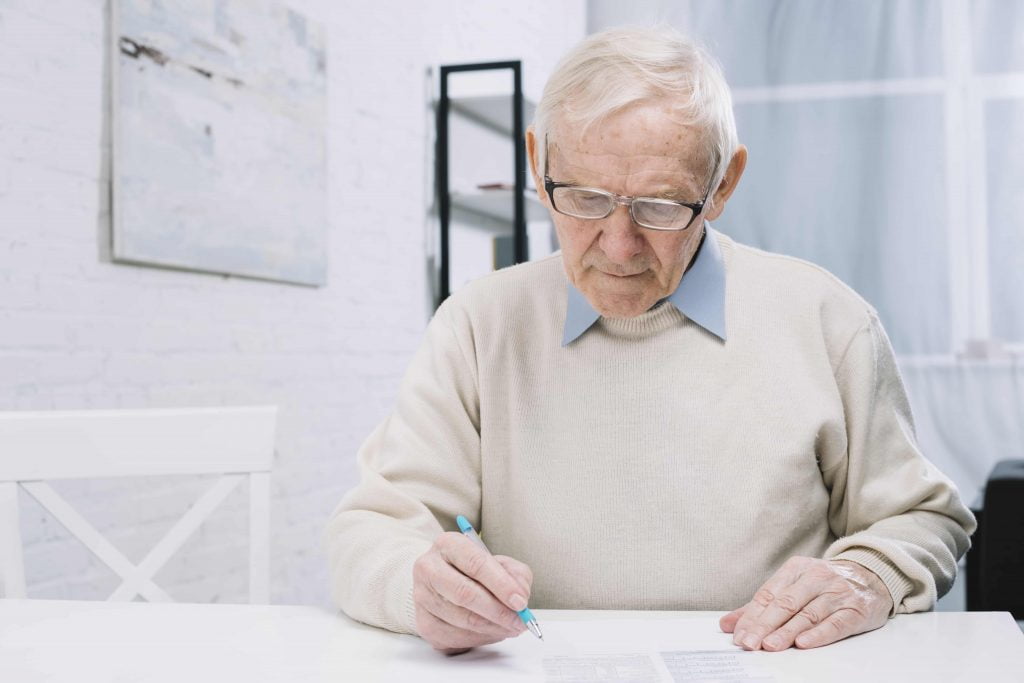 an old man calculating Required Minimum Distribution In & Near Bronx, NY