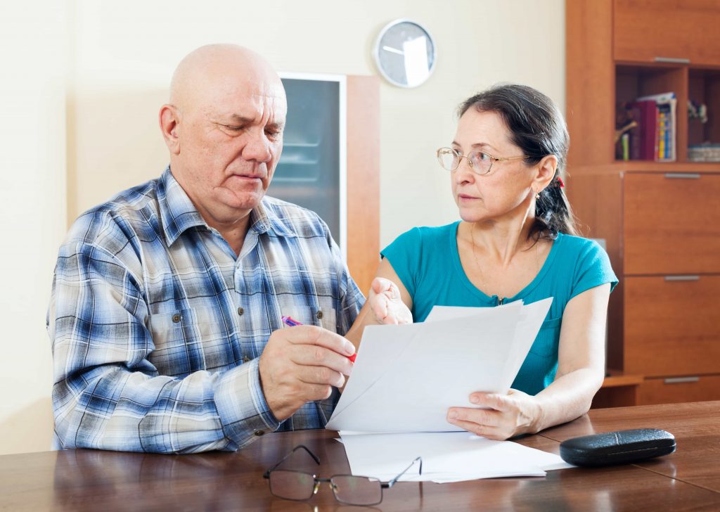 An old couple checking Required Minimum Distribution deadlines In & Near Bronx, NY