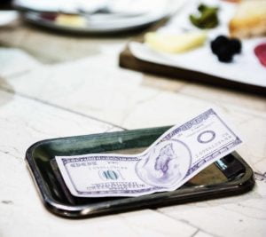 a hundred dollar cash for tips on table in & Near Bronx, NY