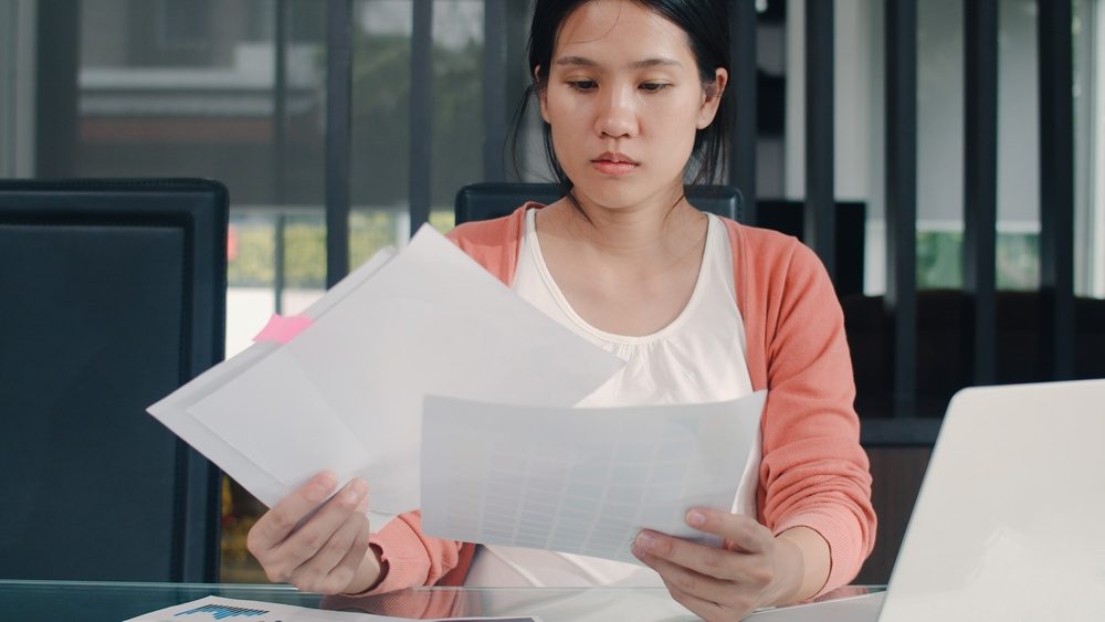 a woman wondering about keeping tax records in & Near Bronx, NY