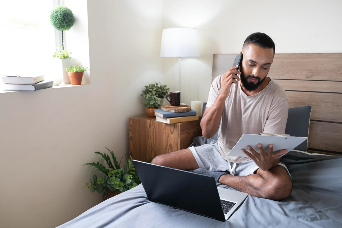 A full shot of a man working on Airbnb tax challenges in Bronx