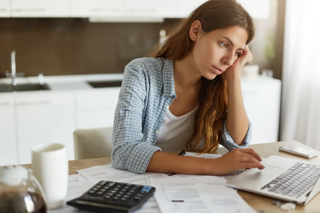 young woman checking her budget doing taxes