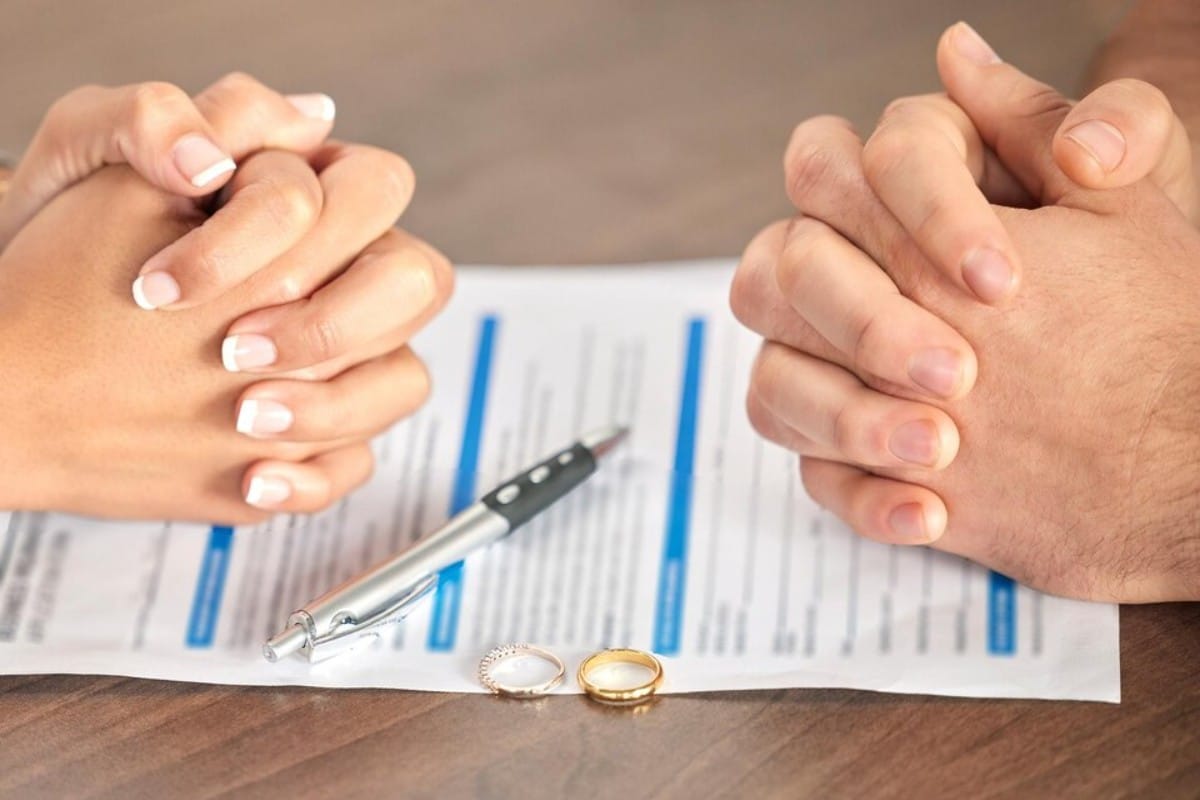 divorce-signing-hands-couple-with-document-court-deal-legal-paperwork-together-conflict-married-man-woman-with-agreement-paperwork-form-end-marriage