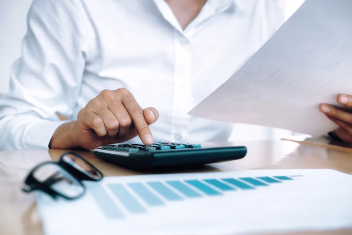 finances-saving-economy-concept-female-accountant-banker-use-calculator