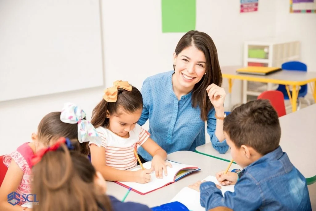 Happy teacher in kindergarten class in and near Bronx, NY