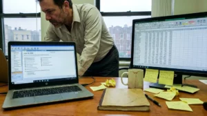 Desk with laptop and tax software open