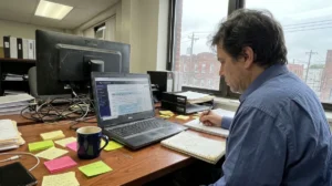 Workspace with laptop open on taxes