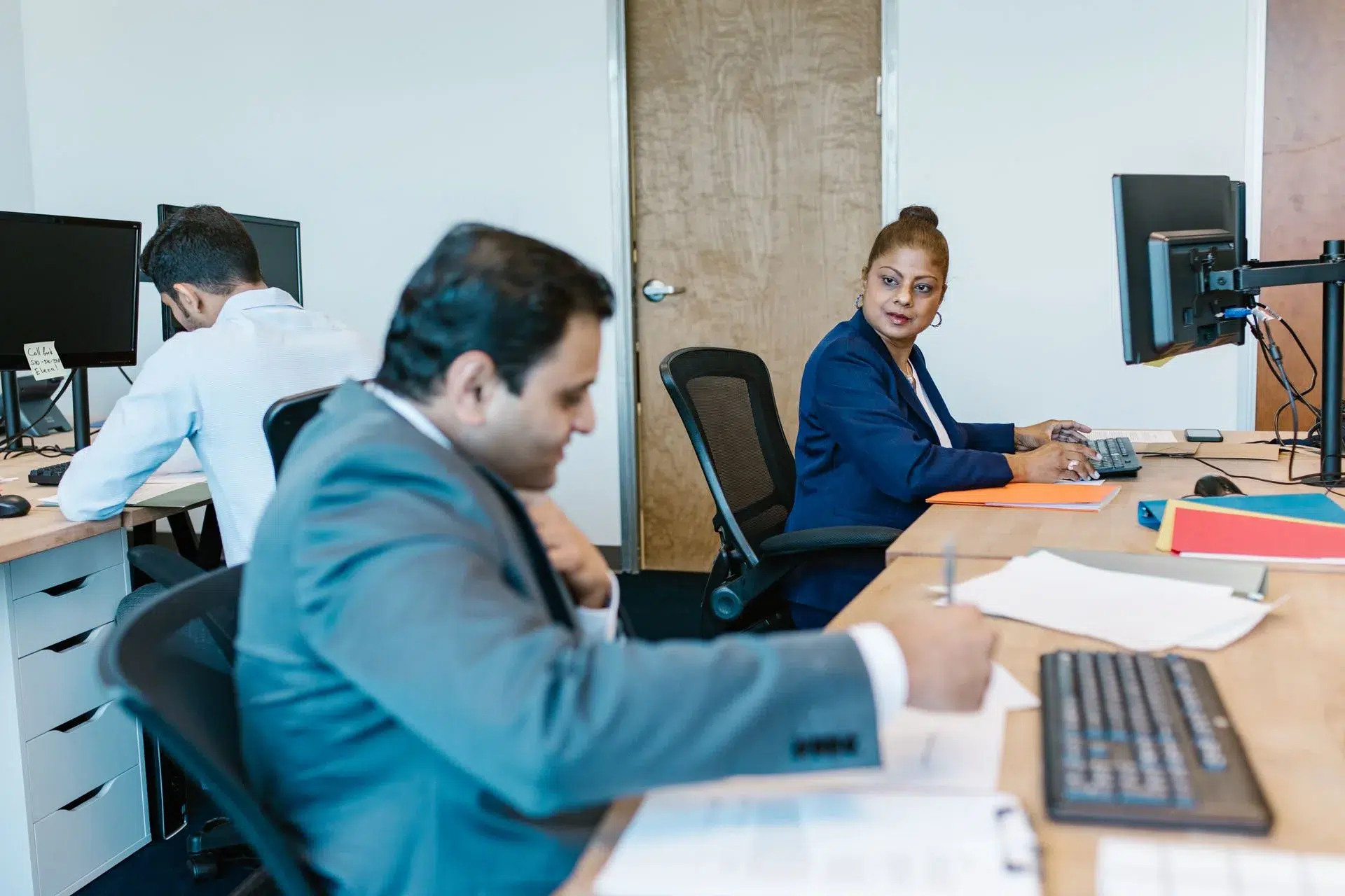 Tax team planning 2026 taxes with a client at SCL Tax Services in the Bronx, NY. 10470